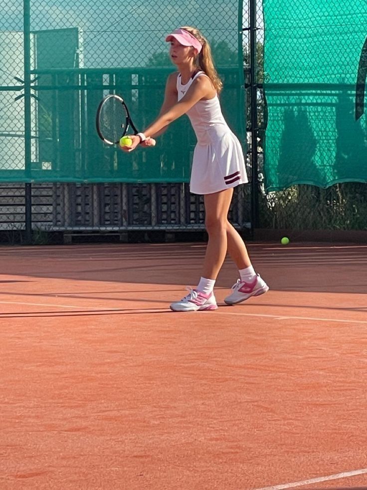 Reference photo of a young tennis player returning a ball on an outdoor court