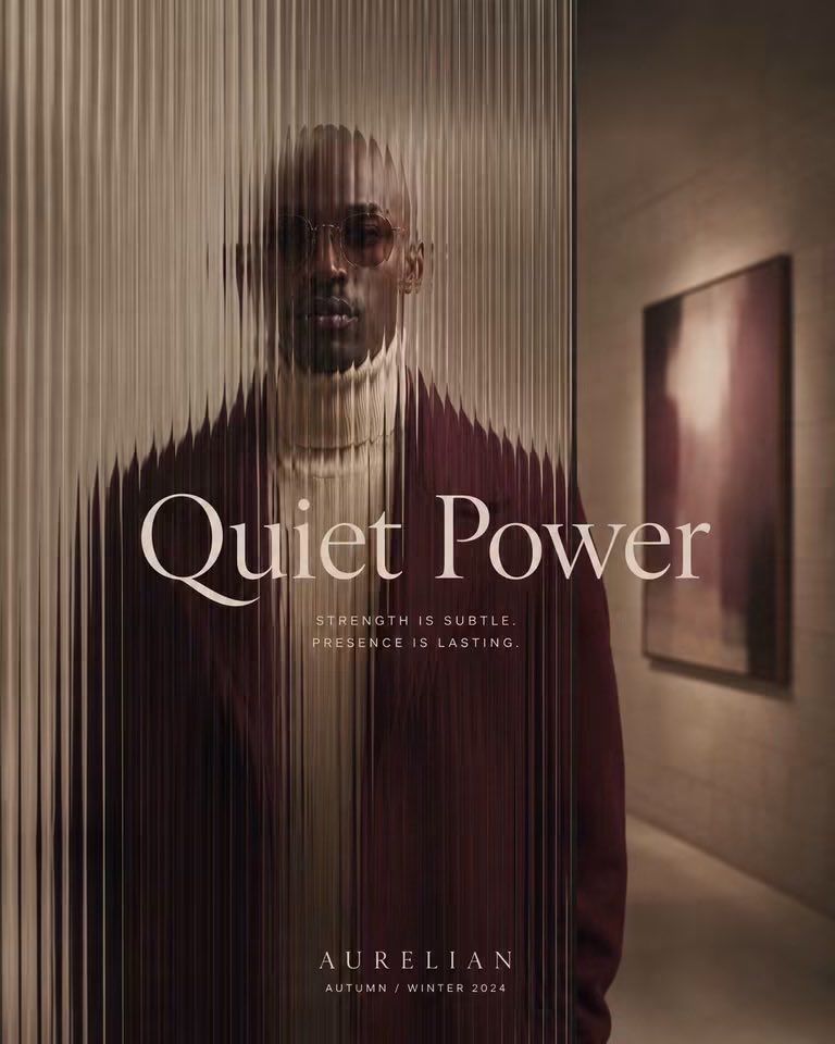 Dark burgundy menswear advertisement with a model seen through corrugated glass